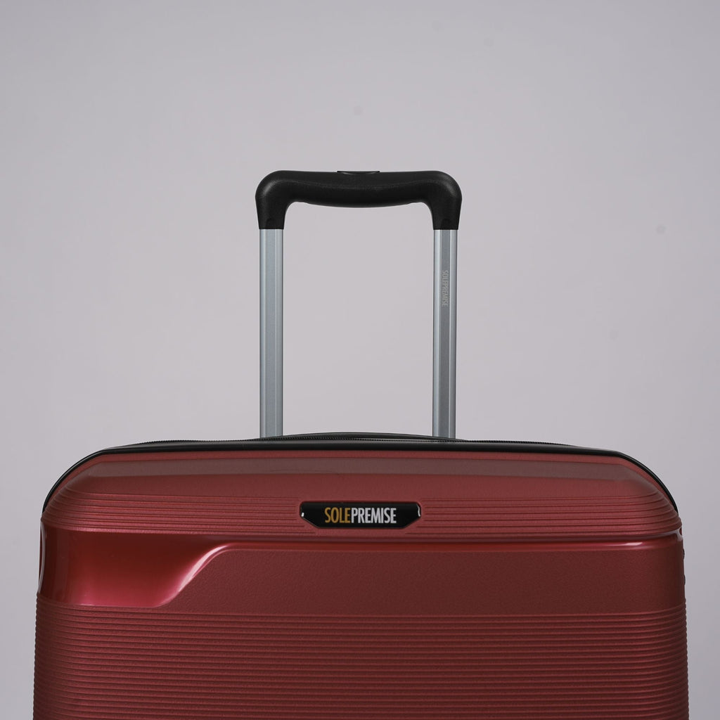 Valise rigide à roulettes rouge de 24 pouces