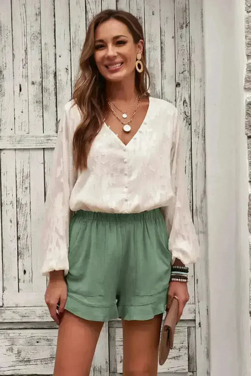 Shorts verts en lin et coton à volants pour femme avec poches