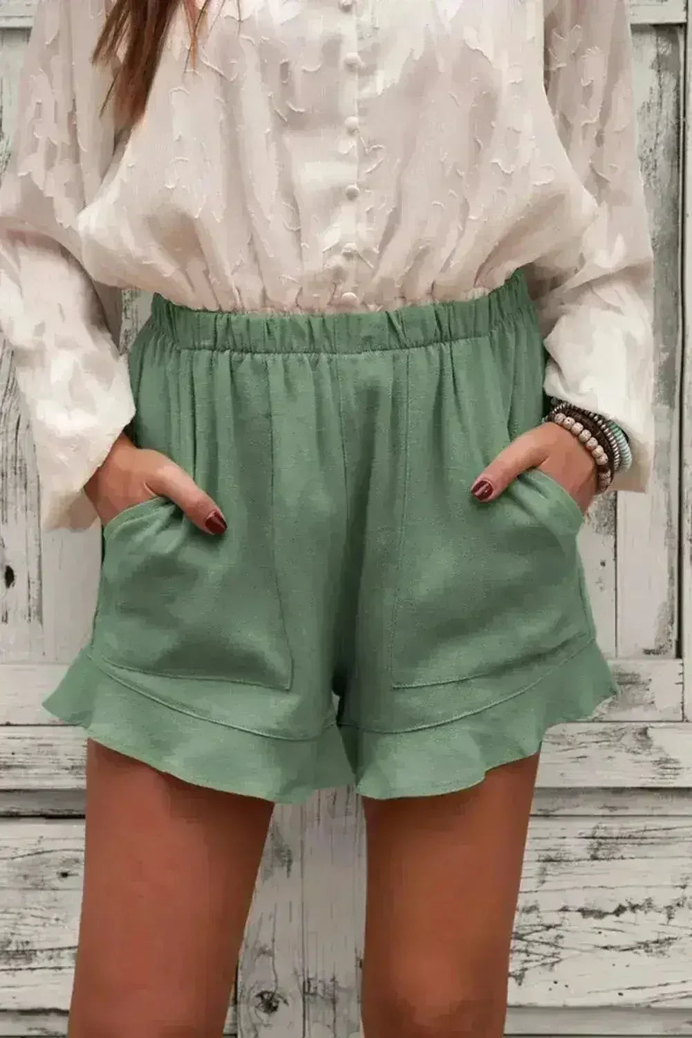 Shorts verts en lin et coton à volants pour femme avec poches