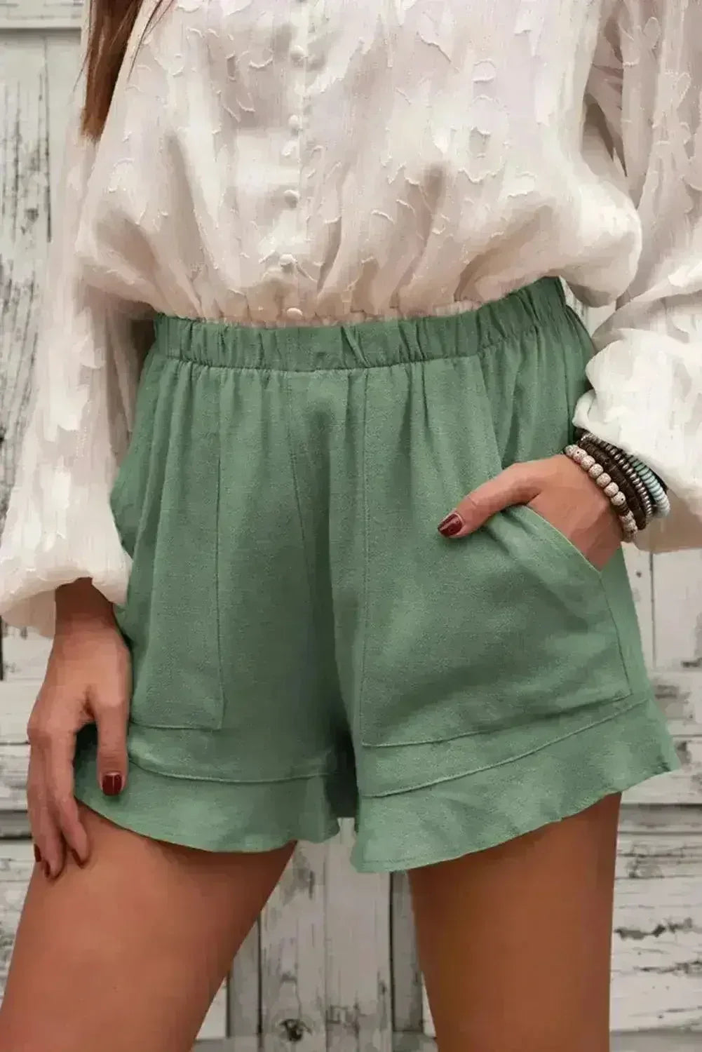 Shorts verts en lin et coton à volants pour femme avec poches
