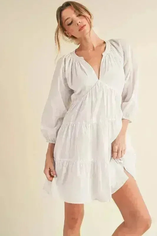Mini-robe étagée à manches ballon entaillées Aemi + Co