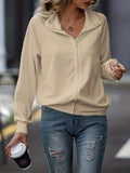 Veste décontractée blanche zippée à col, manches raglan, confortable et polyvalente pour femme.