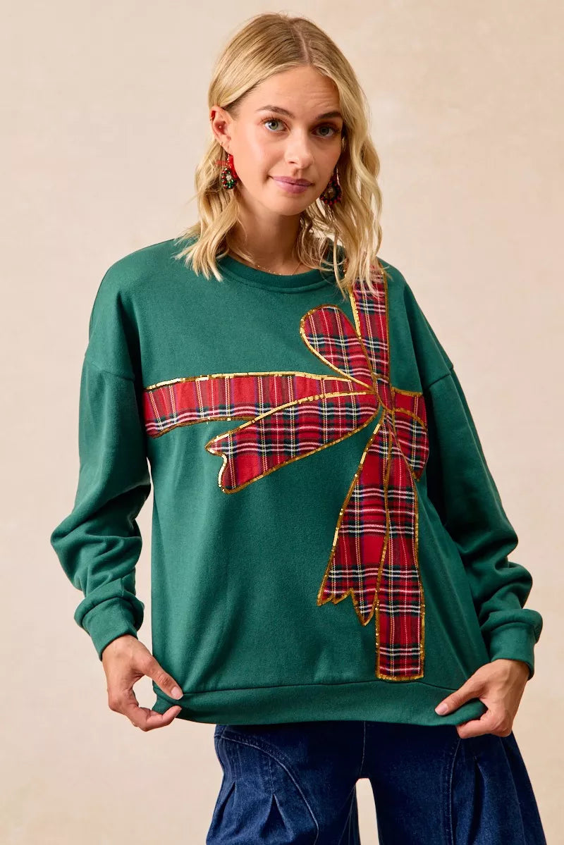 Pull en polaire de Noël BiBi avec nœud en ruban écossais