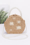 Pochette artisanale imitation paille avec anse perlée