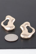 Boucles d'oreilles flaque d'eau modernes abstraites