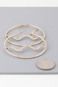 Boucles d'oreilles créoles serpent serties de pierres