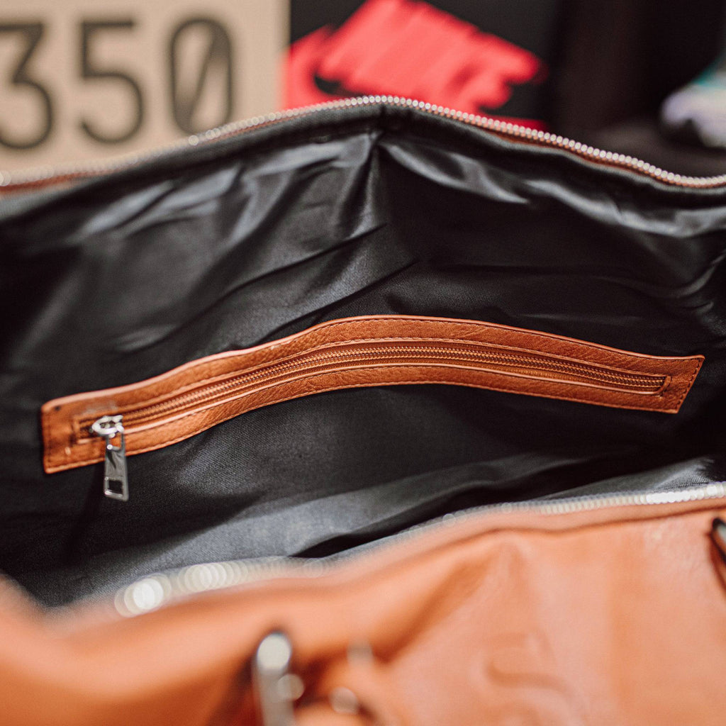 Sac de voyage en cuir marron effet vieilli