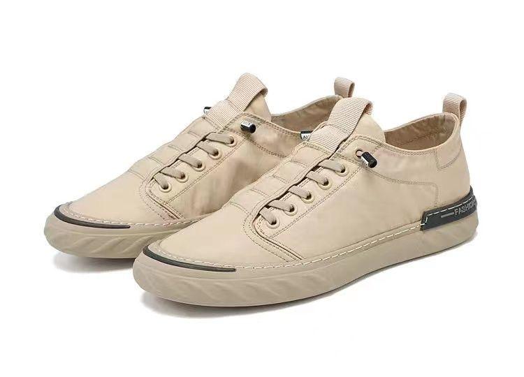 Baskets décontractées en toile pour hommes, confortables et polyvalentes, respirantes, chaussures de sport plates, légères, pour la marche en extérieur, design moderne.