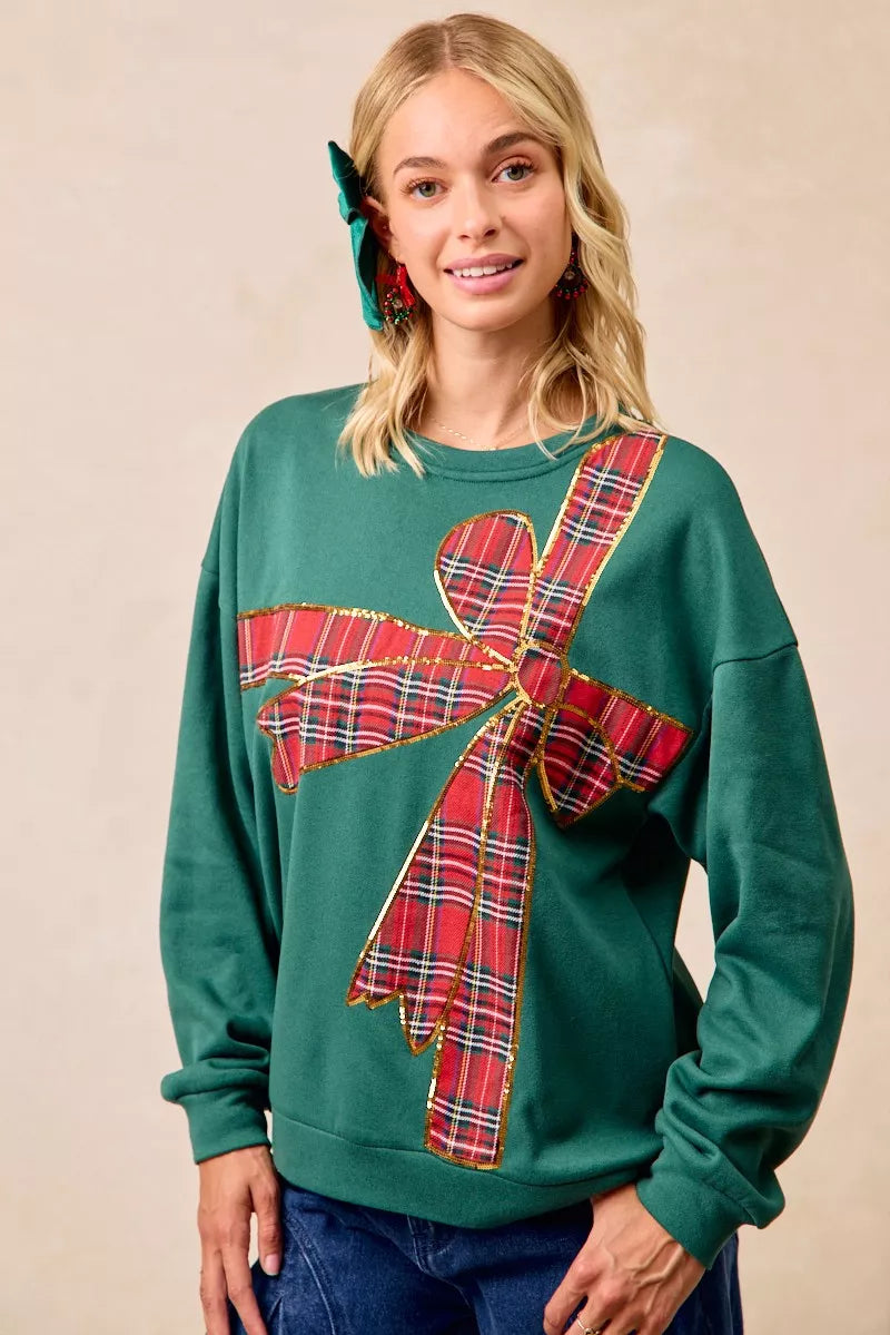Pull en polaire de Noël BiBi avec nœud en ruban écossais