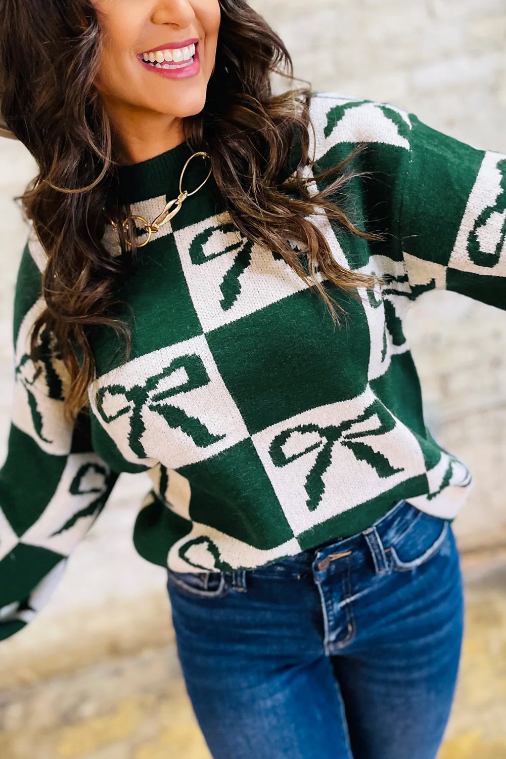 Pull en maille à carreaux vert noirâtre avec nœuds imprimés