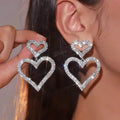 Boucles d'oreilles clous chic doubles cœurs en strass