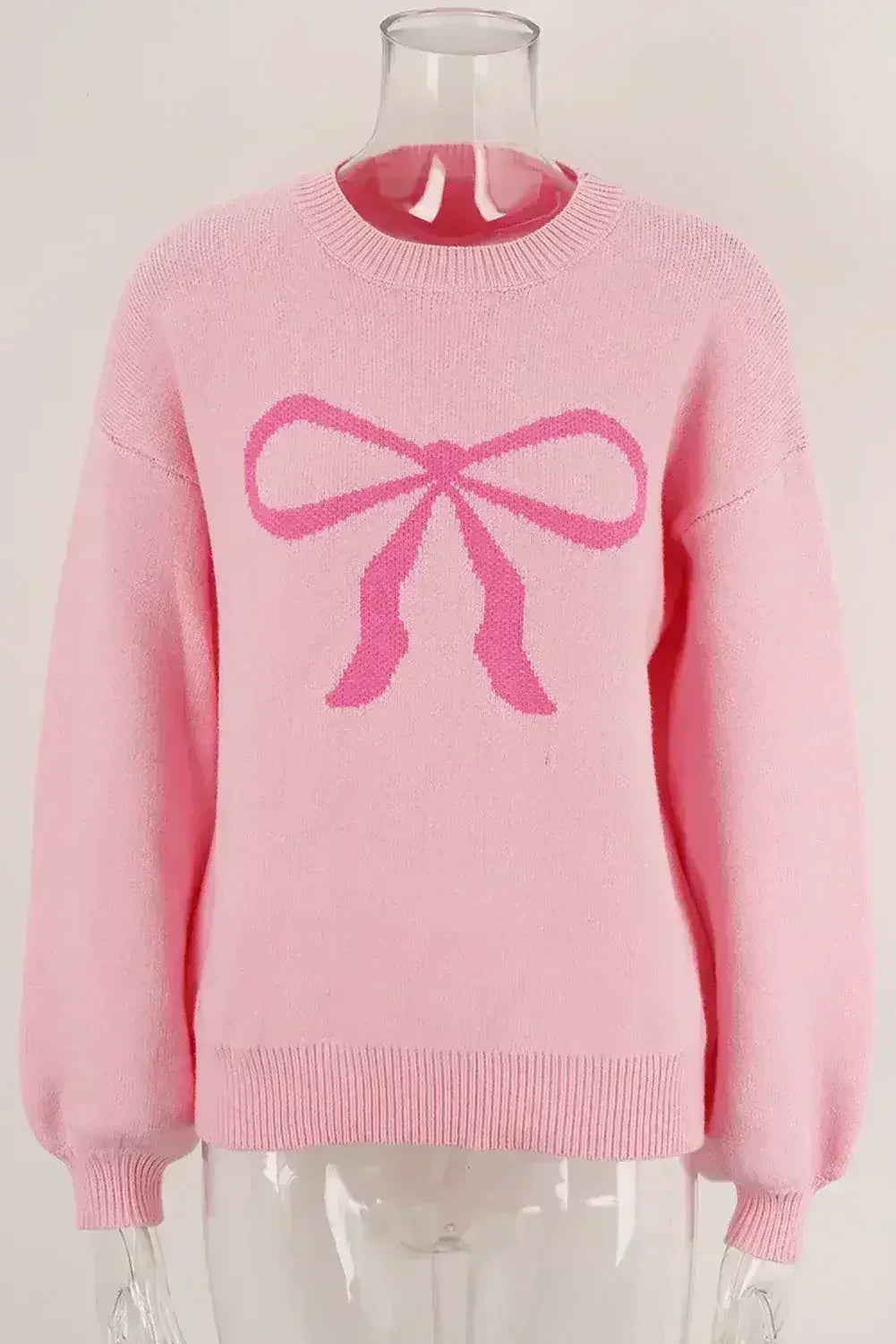 Pull col rond à nœud rose