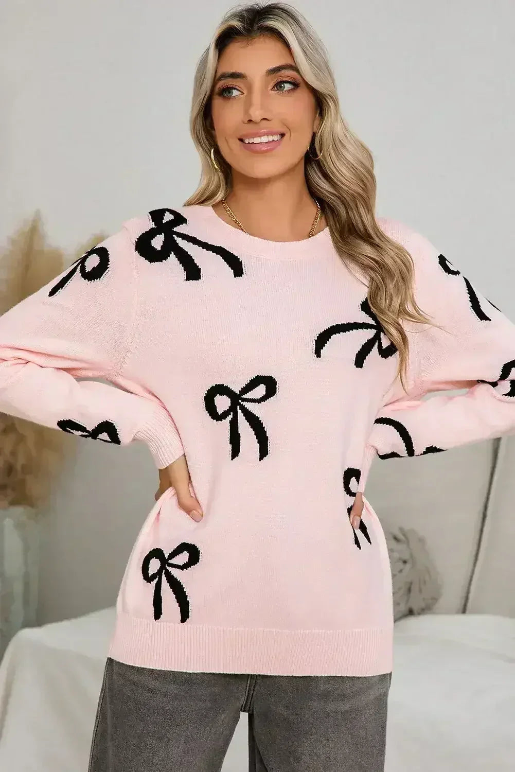 Pull ample à manches longues imprimé de nœuds rose clair