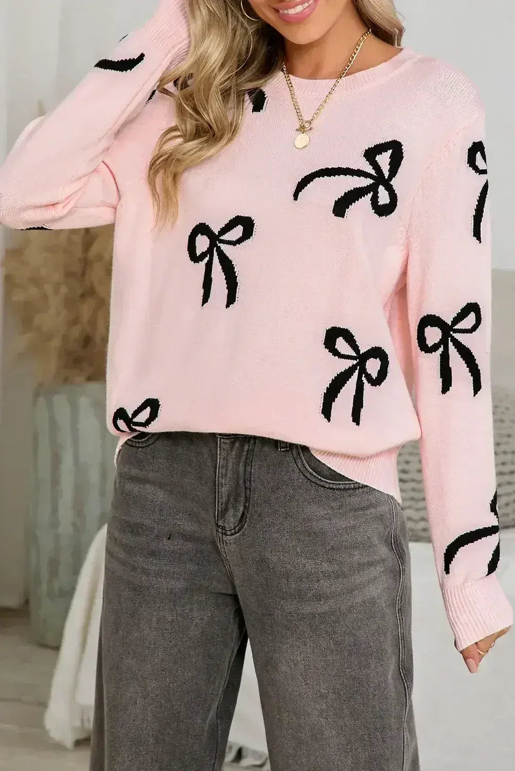 Pull ample à manches longues imprimé de nœuds rose clair
