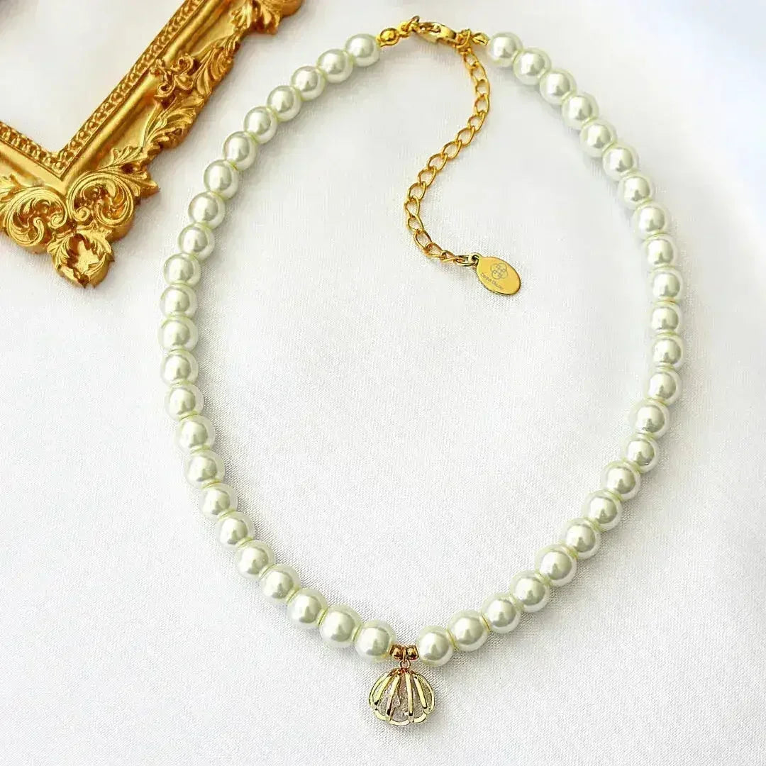 Ras de cou 24 carats en perles tchèques coquillages