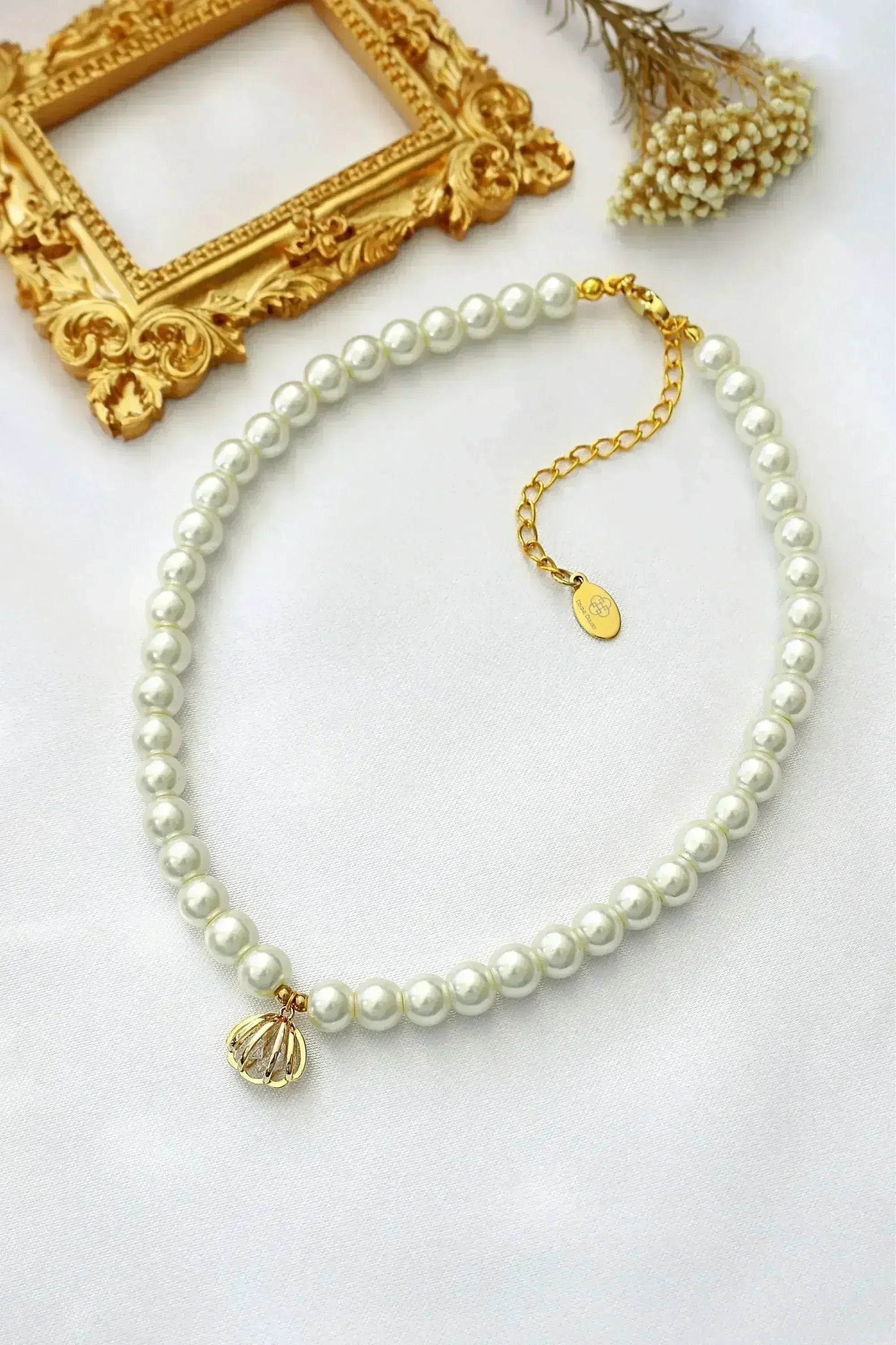 Ras de cou 24 carats en perles tchèques coquillages