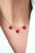 Collier 3 cœurs rouges en or 24 carats