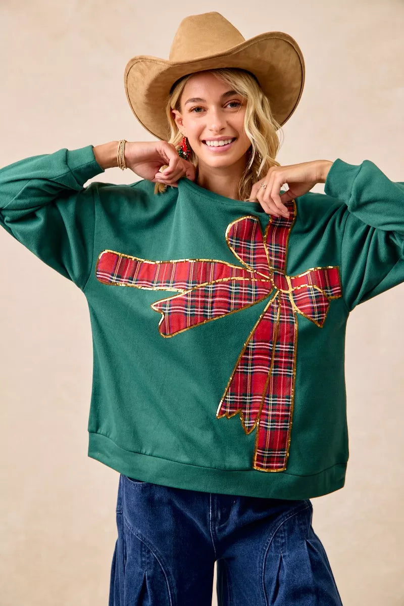 Pull en polaire de Noël BiBi avec nœud en ruban écossais