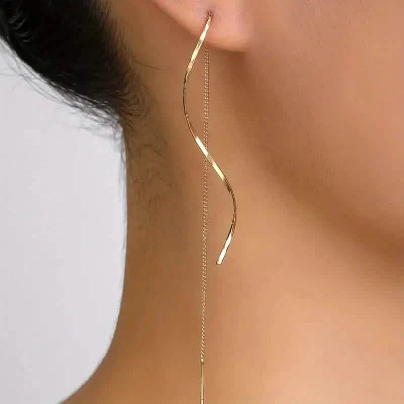 Boucles d'oreilles pendantes dorées motif S