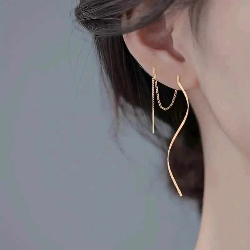 Boucles d'oreilles pendantes dorées motif S