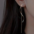 Boucles d'oreilles pendantes dorées motif S