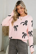Pull ample à manches longues imprimé de nœuds rose clair