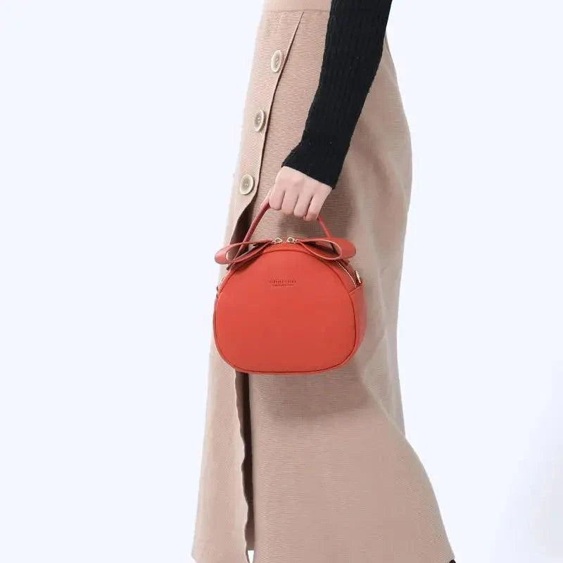 Sac à main femme élégant et mignon géométrique en cuir PU souple, sac bandoulière rond pour femme.