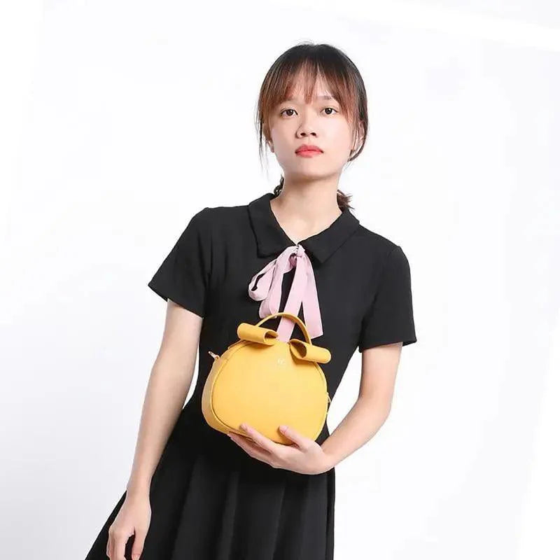 Sac à main femme élégant et mignon géométrique en cuir PU souple, sac bandoulière rond pour femme.
