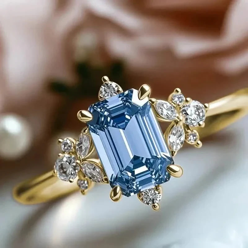 Élégante bague de fiançailles en cuivre plaqué or avec oxyde de zirconium bleu carré