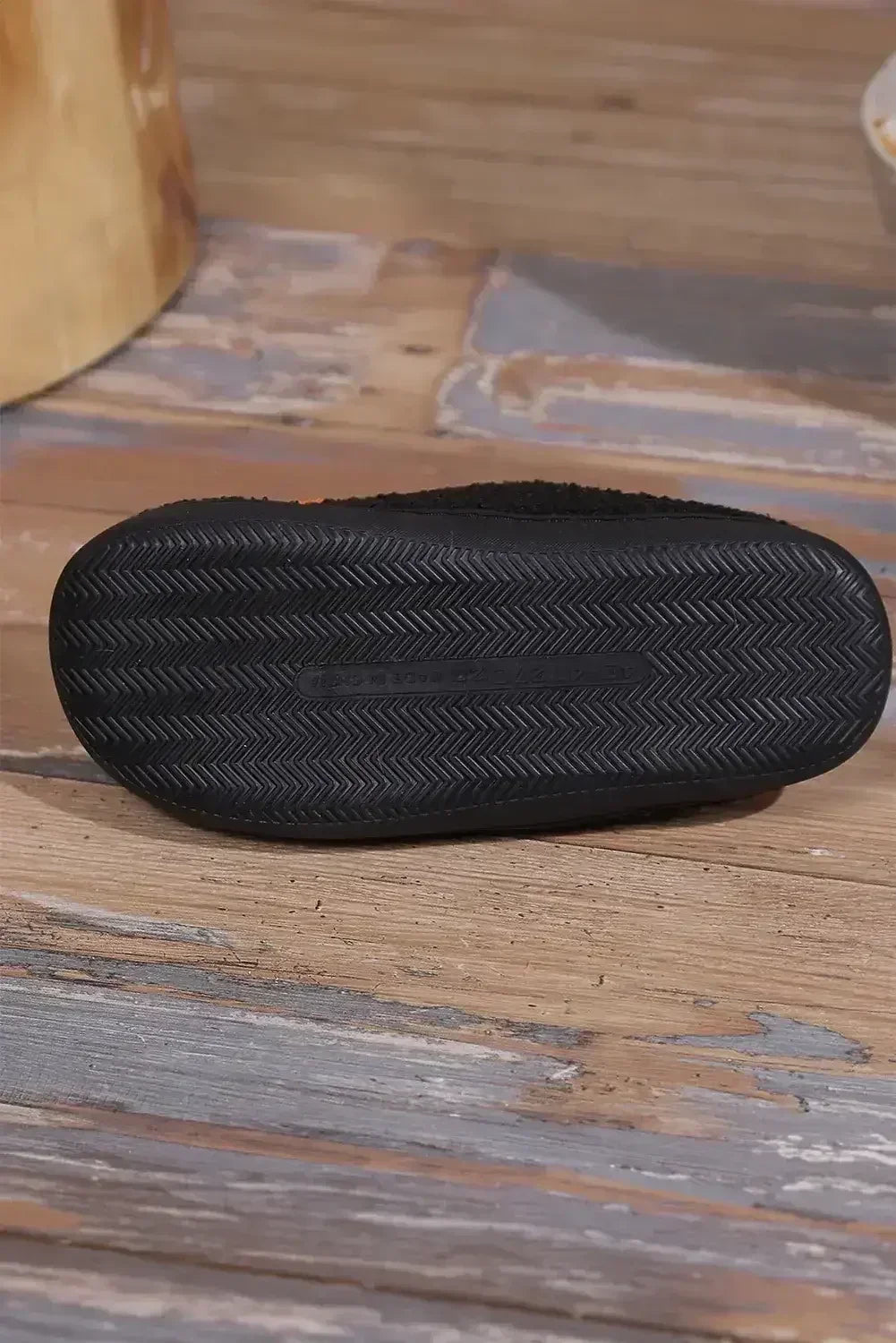 Pantoufles en peluche noires à imprimé citrouille d'Halloween