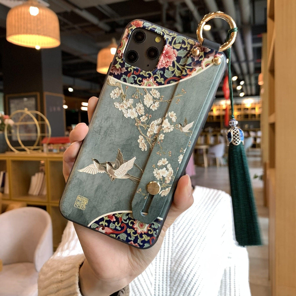 Coque de téléphone à motif floral tendance pour iPhone 11 12 13 14 Pro MAX X XS MAX XR 8 7 6 6s Plus X, étui souple avec dragonne et pompon, antichoc, coque arrière rigide, fine, protection intégrale, tendance, mignonne, élégante pour femme