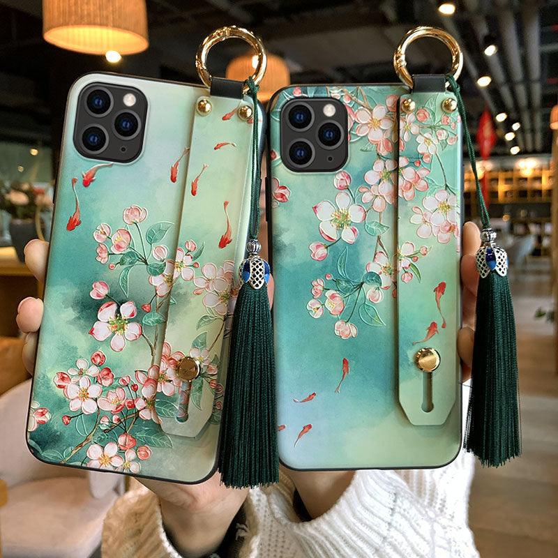 Coque de téléphone à motif floral tendance pour iPhone 11 12 13 14 Pro MAX X XS MAX XR 8 7 6 6s Plus X, étui souple avec dragonne et pompon, antichoc, coque arrière rigide, fine, protection intégrale, tendance, mignonne, élégante pour femme