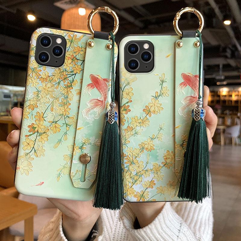 Coque de téléphone à motif floral tendance pour iPhone 11 12 13 14 Pro MAX X XS MAX XR 8 7 6 6s Plus X, étui souple avec dragonne et pompon, antichoc, coque arrière rigide, fine, protection intégrale, tendance, mignonne, élégante pour femme