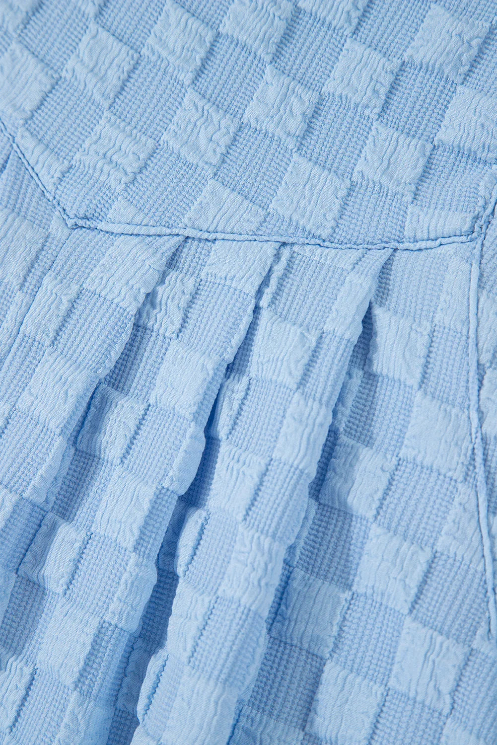 Salopette ample à carreaux beige avec poches et taille haute