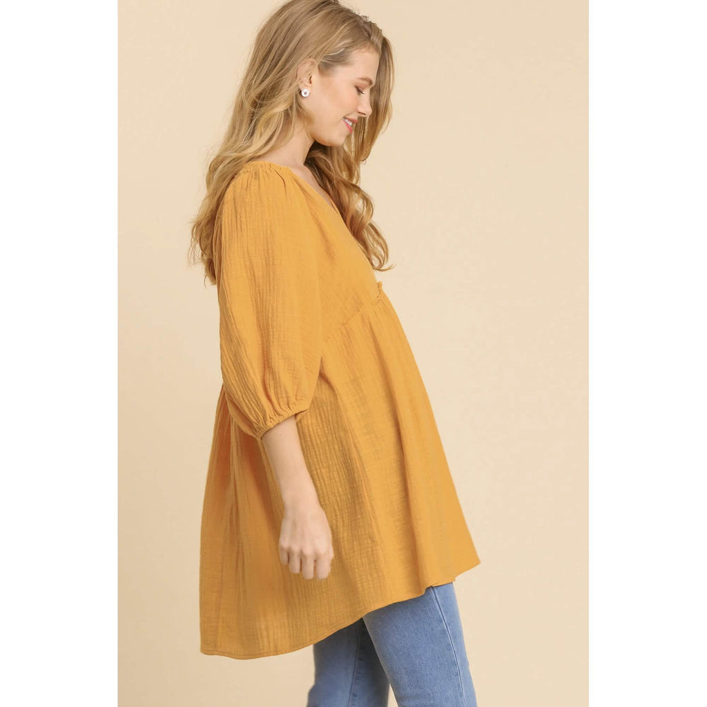Robe tunique à col en V en gaze flammée avec bords effilochés