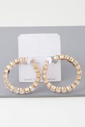 Boucles d'oreilles créoles géométriques taillées en strass