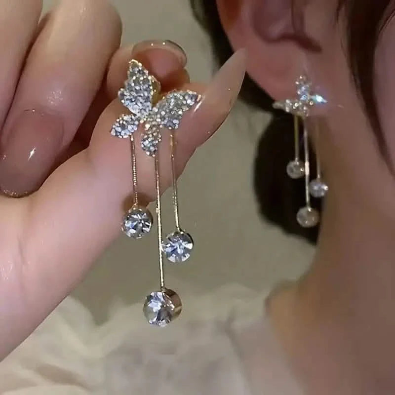 Boucles d'oreilles pendantes en alliage ton or et oxyde de zirconium