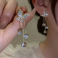 Boucles d'oreilles pendantes en alliage ton or et oxyde de zirconium