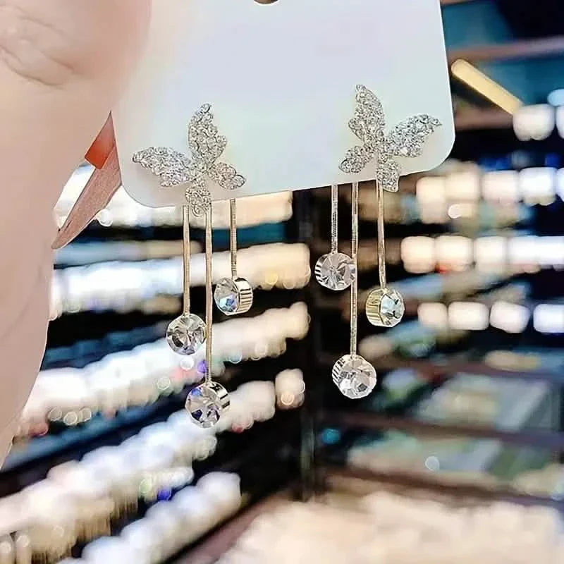 Boucles d'oreilles pendantes en alliage ton or et oxyde de zirconium