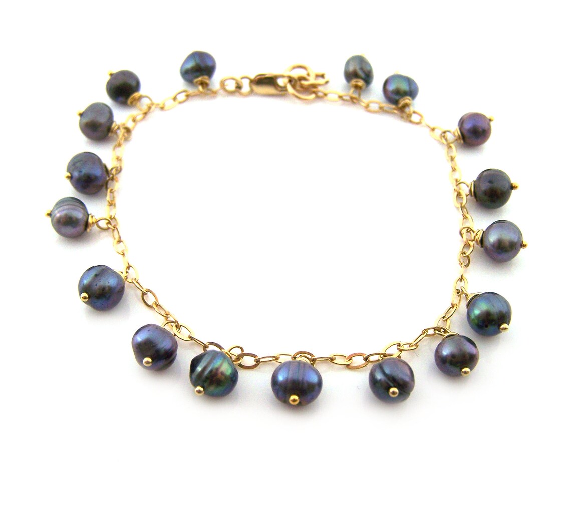 Bracelet fin chaîne remplie or perle d'eau douce paon