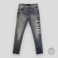 Jeans Amiri gris à motif militaire au pochoir