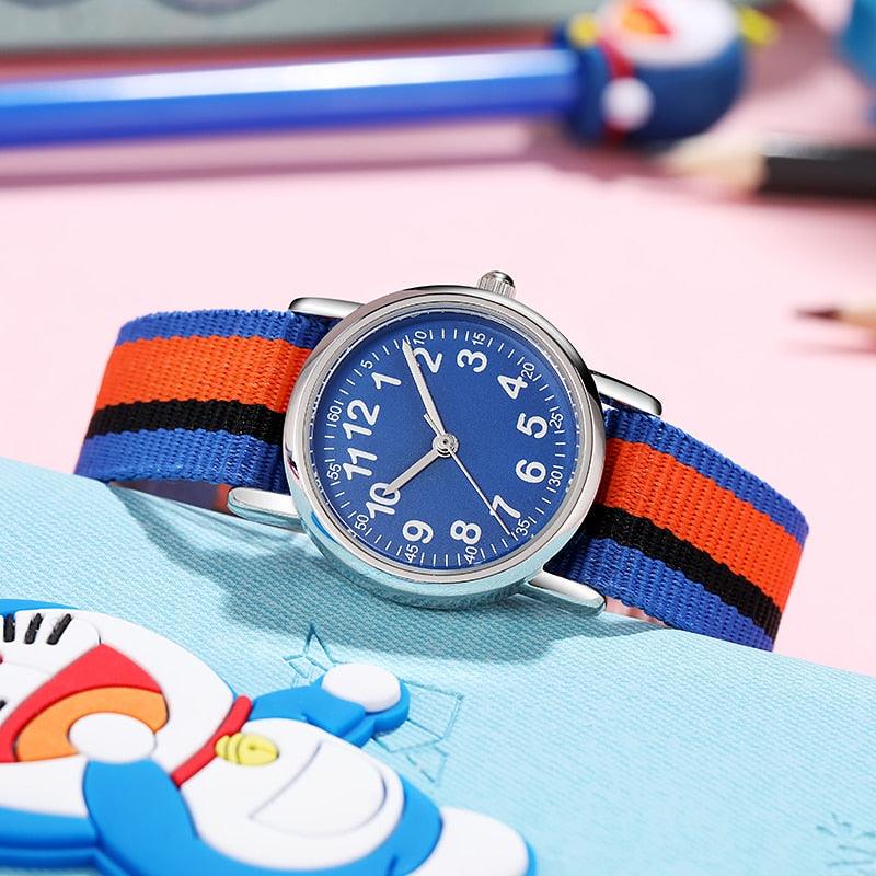 Montre pour enfants, bracelet en nylon multicolore, cadeau pour enfants, étudiants, montre analogique facile à lire, première montre pour enfants, montre-bracelet quotidienne pour garçons et filles avec bracelet en tissu doux