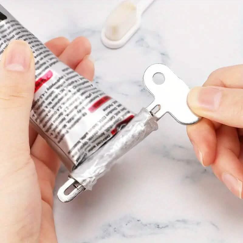 Outil distributeur de tube à presser manuel pour dentifrice