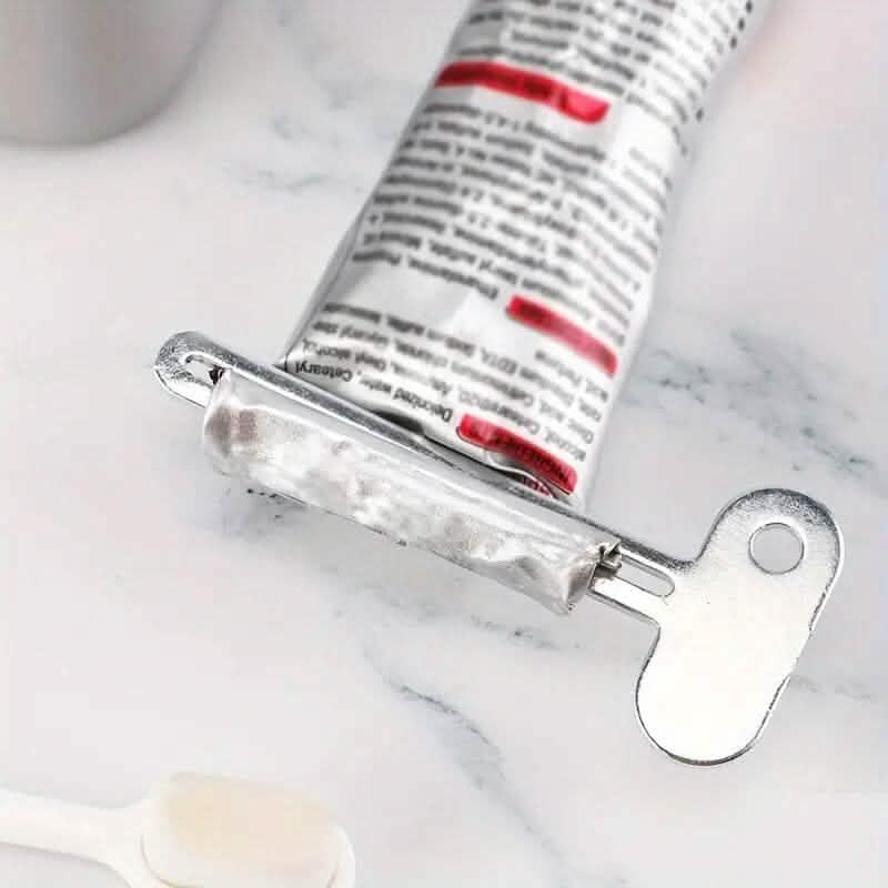 Outil distributeur de tube à presser manuel pour dentifrice