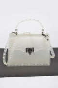 Pochette cloutée monochrome