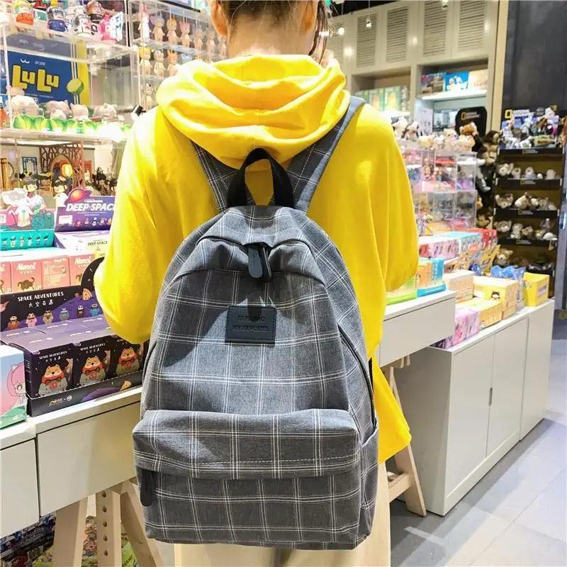 Nouveau sac à dos décontracté pour femmes et filles Sac à dos élégant à rayures pour adolescentes
