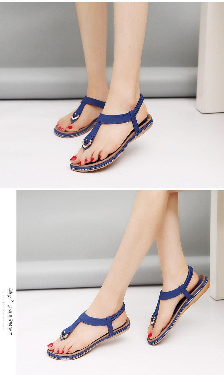 Nouvelles sandales plates pour femme, tongs décontractées d'été, chaussures simples pour femme, pantoufles à semelle souple, tongs élastiques et confortables à lanières en T, chaussures de plage