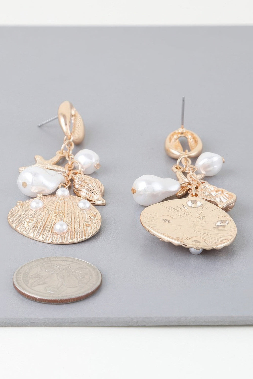 Boucles d'oreilles pendantes perlées sous la mer
