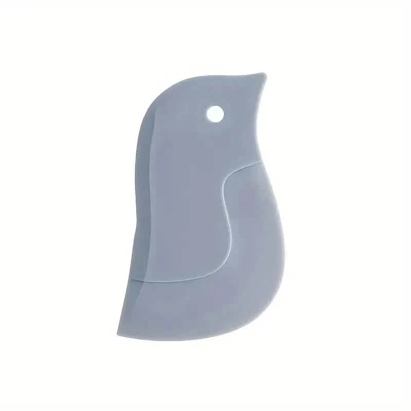 Outil racloir souple de cuisine en forme de pingouin pour enlever les taches
