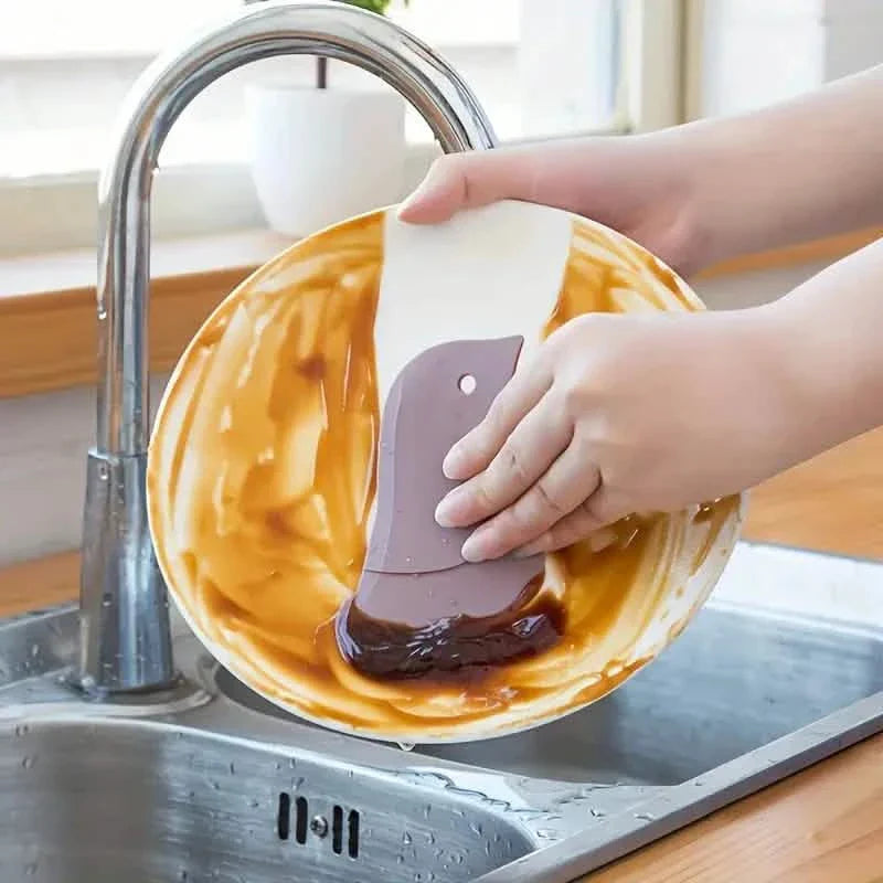 Outil racloir souple de cuisine en forme de pingouin pour enlever les taches